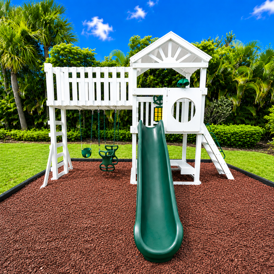 white vinyl swing set with roof, slide, swings and rubber mulch