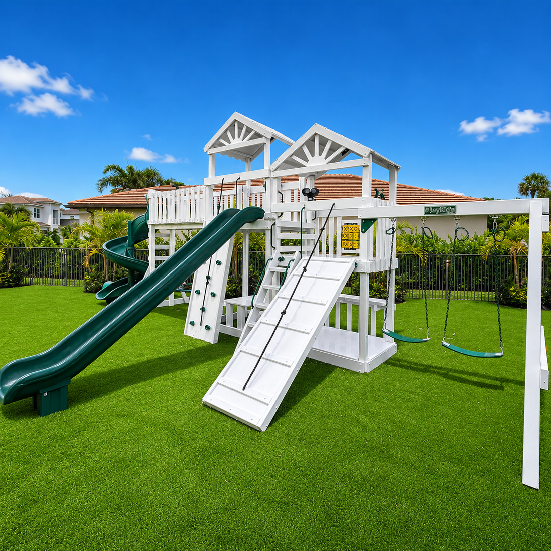 white vinyl swing set with roof, slide, swings and ramp
