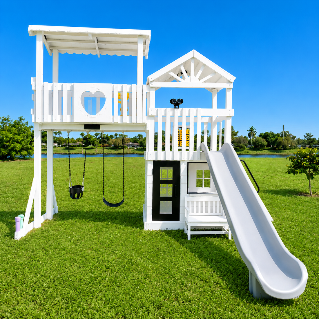 white vinyl swing set with roof, slide, swings and playhouse